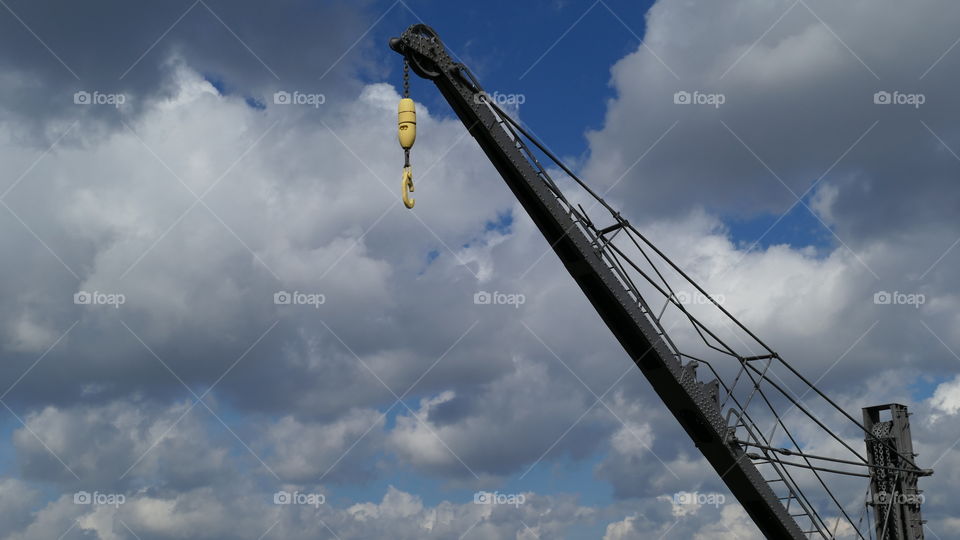 Crane and a cloudy sky.