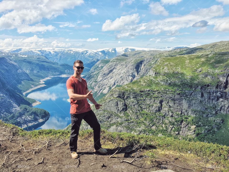 Thumbs up while hike to Trolltunga 