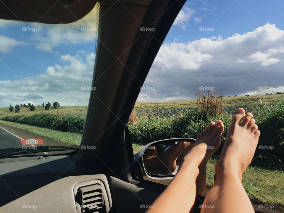 Sticking my feet out the window on a roadtrip.