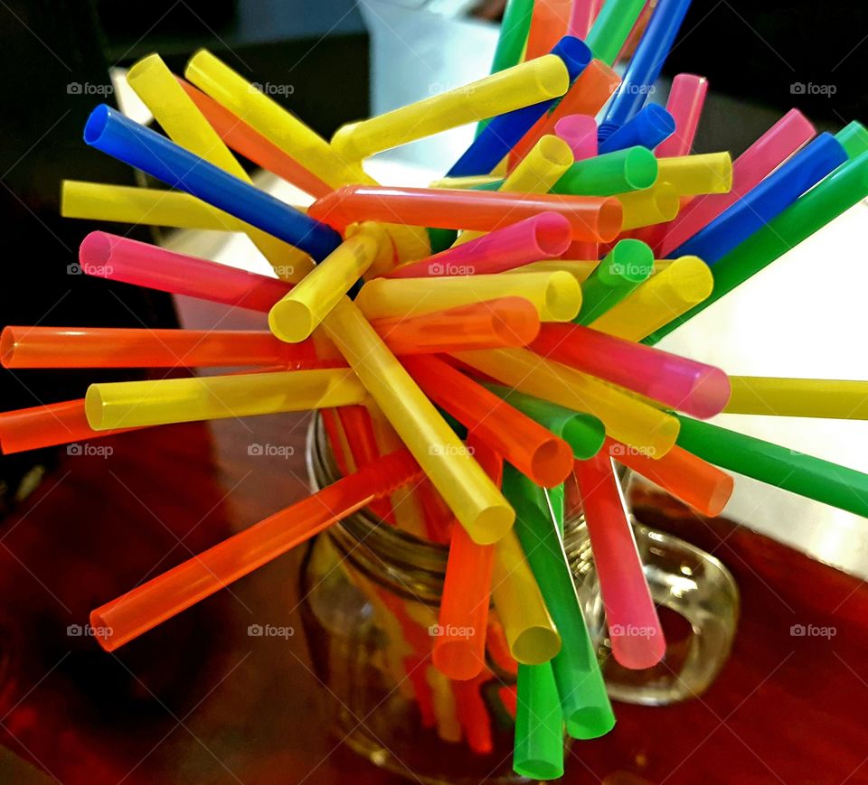 Straws in a jar on a table