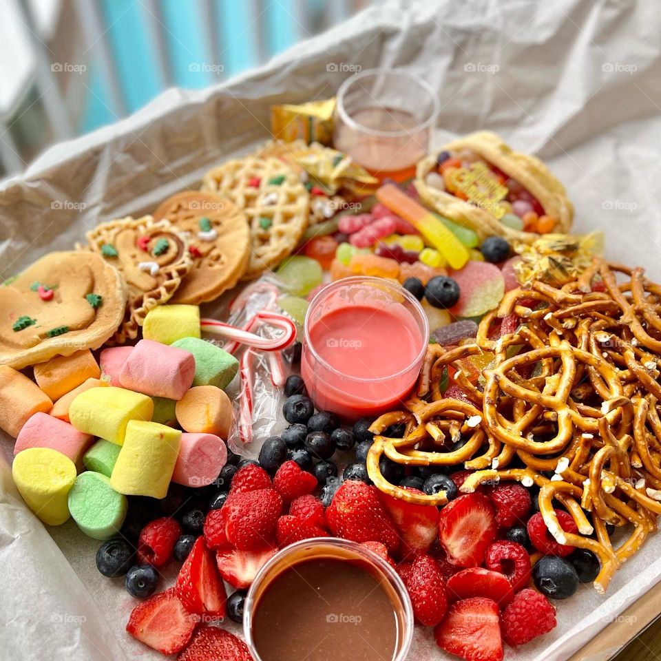 Festive party box full of yummy goodies of gummies and waffles 